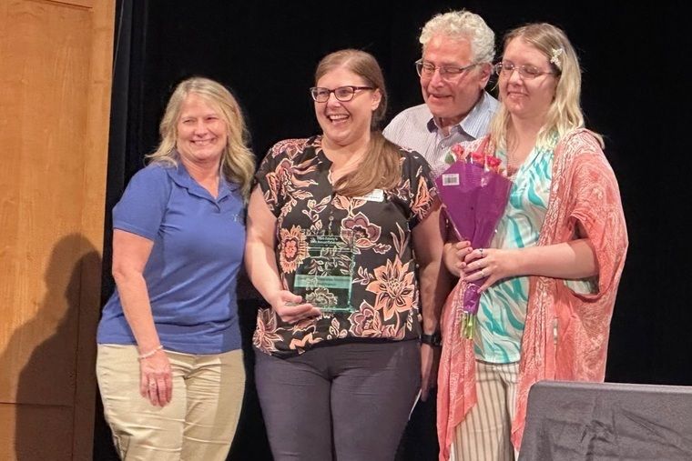 Chelsy Smith and the admin team accept the NDEAM for Small Employer of the Year 2026 on behalf of Davidson & Associates Insurance