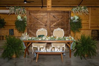 Elegantly rustic sweetheart table at The Barn at Lakeside Ranch