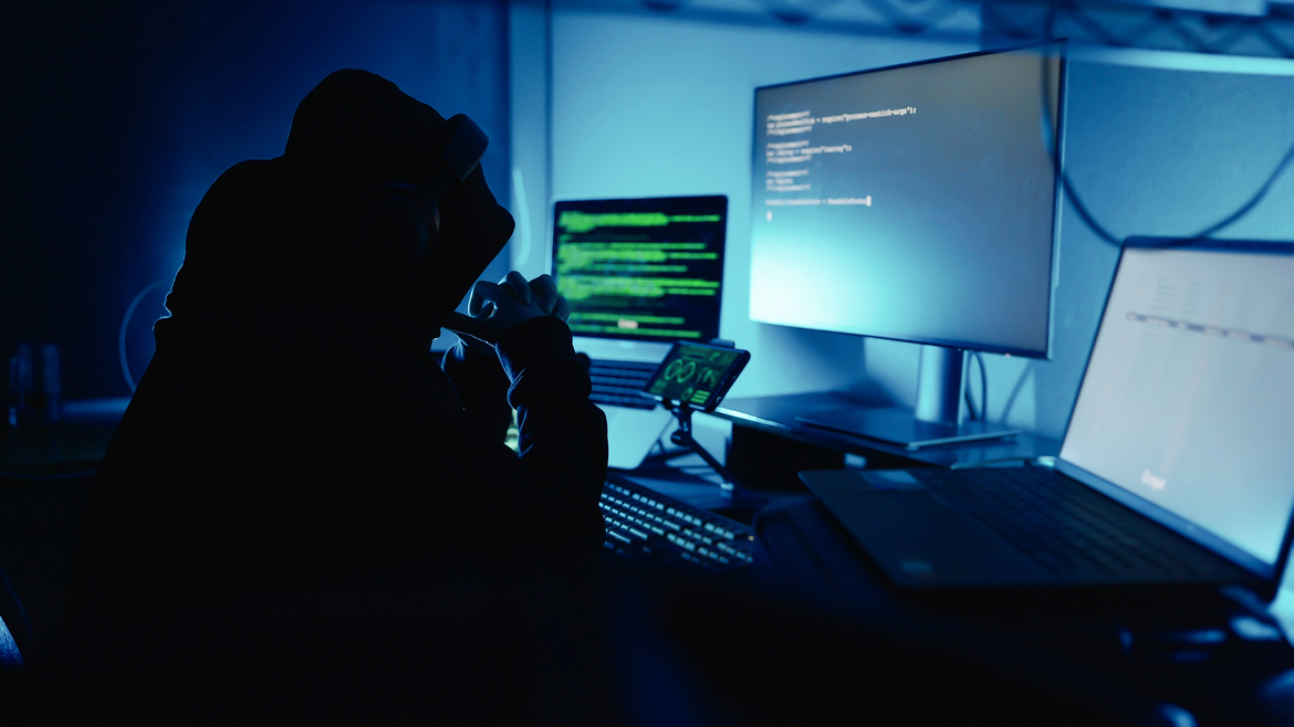 Cyber criminal preparing a ransomware attack targeting a tech company