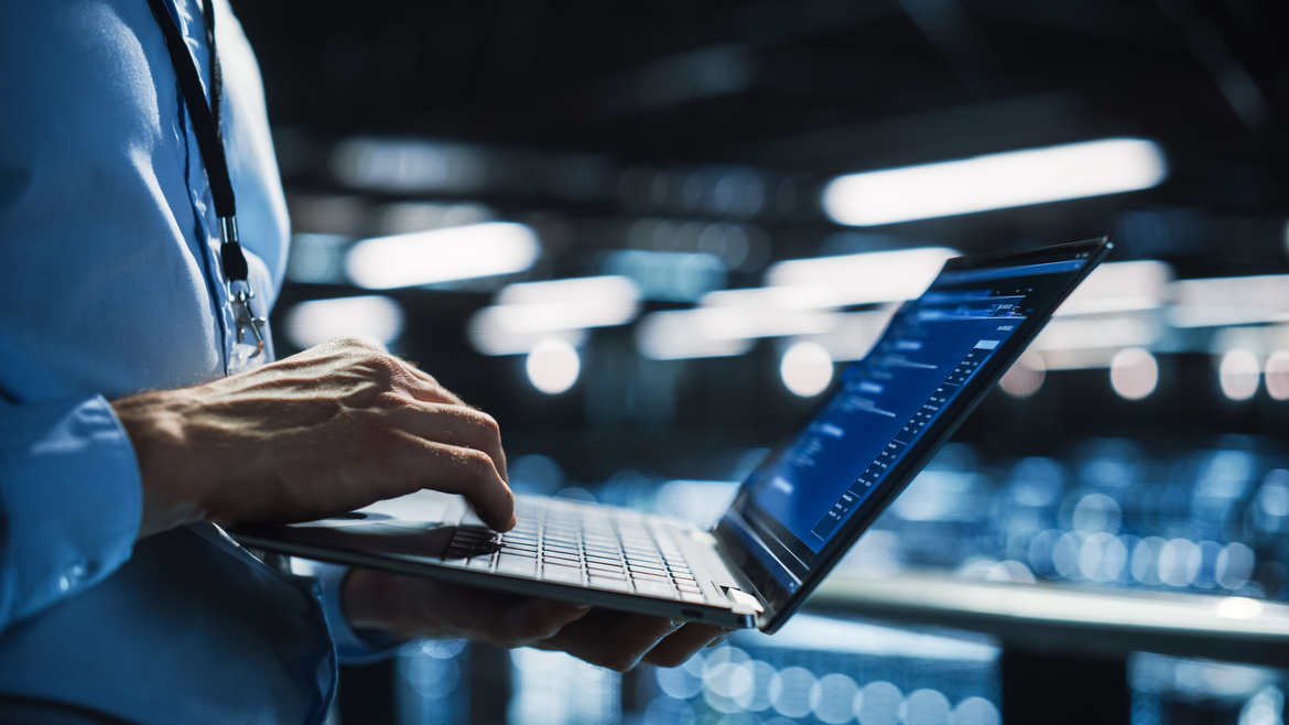Data professional working on a laptop